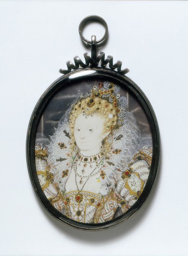 Watercolour. This oval painting shows Elizabeth I with notably pale skin. Her blond hair is piled high on her head and encrusted with jewels under a crown. Her elaborately embroidered bodice and puffed sleeves are also sewn with jewels. She wears several necklaces, and her head is framed by a full, high, lace ruff.