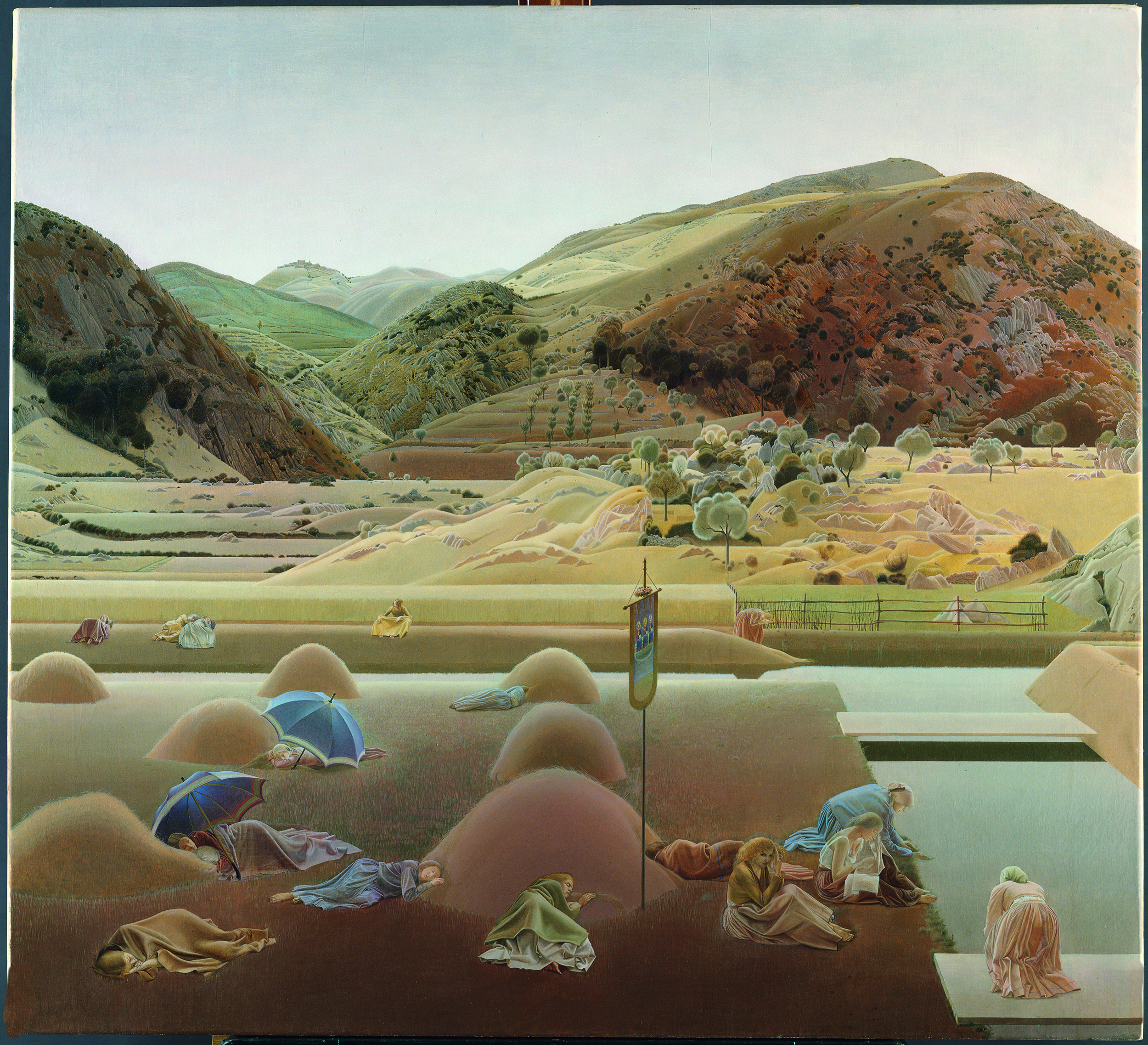 Painting. Sixteen women sit, kneel, or lie among mounds on a field in front of us. All wear long dresses and some are under blankets. Two are under beach umbrellas, and a banner with three figures hangs near the front centre of the painting. A far reaching mountain landscape coloured in faded reds and greens rolls into the distance.
