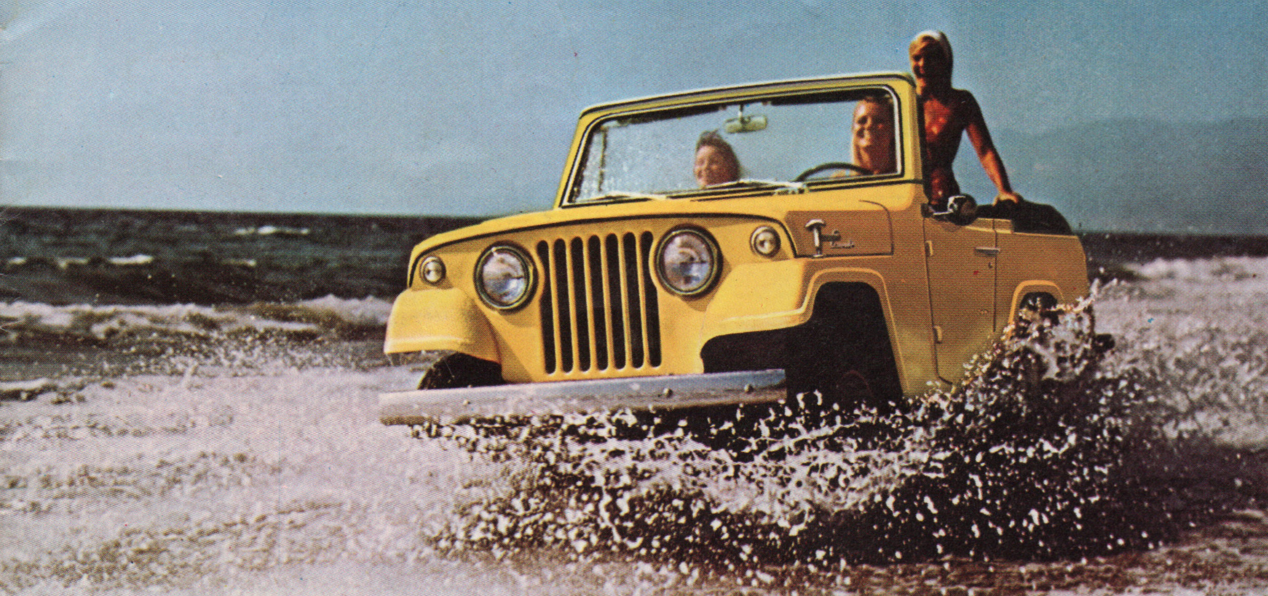 Ad. Three smiling women ride in foamy surf in an open-topped, yellow Jeep.