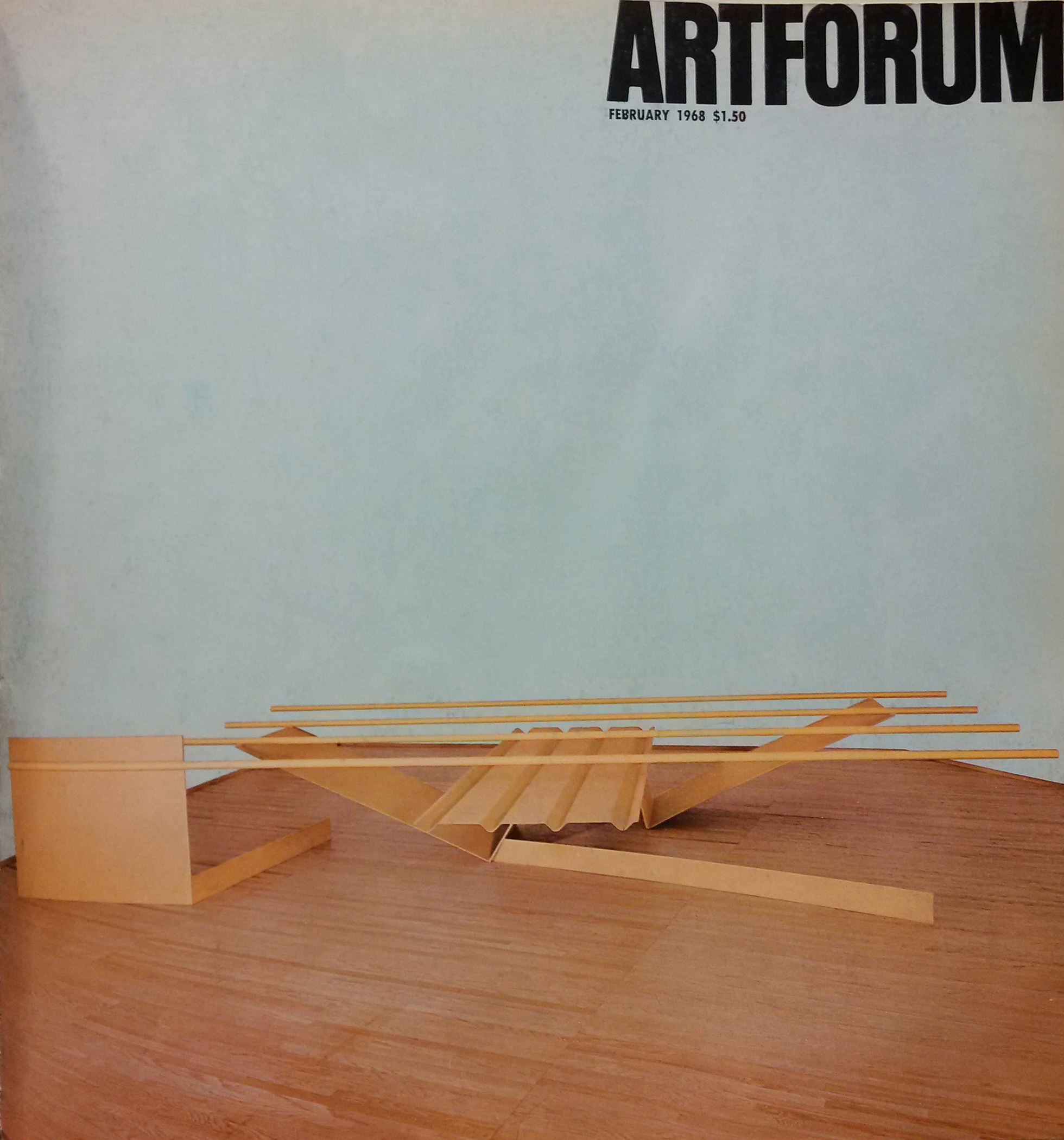 Magazine cover. An abstract sculpture made of harvest-yellow, metal tubes and panels sits on a wood floor. Text in the upper right corner indicates a price of $1.50.