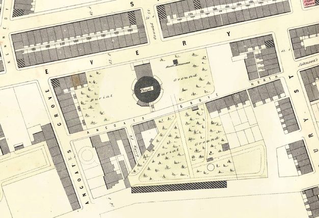 Map. A round chapel is surrounded by spaces marked as “Burial Ground”. Buildings fill the remaining spaces between the streets.