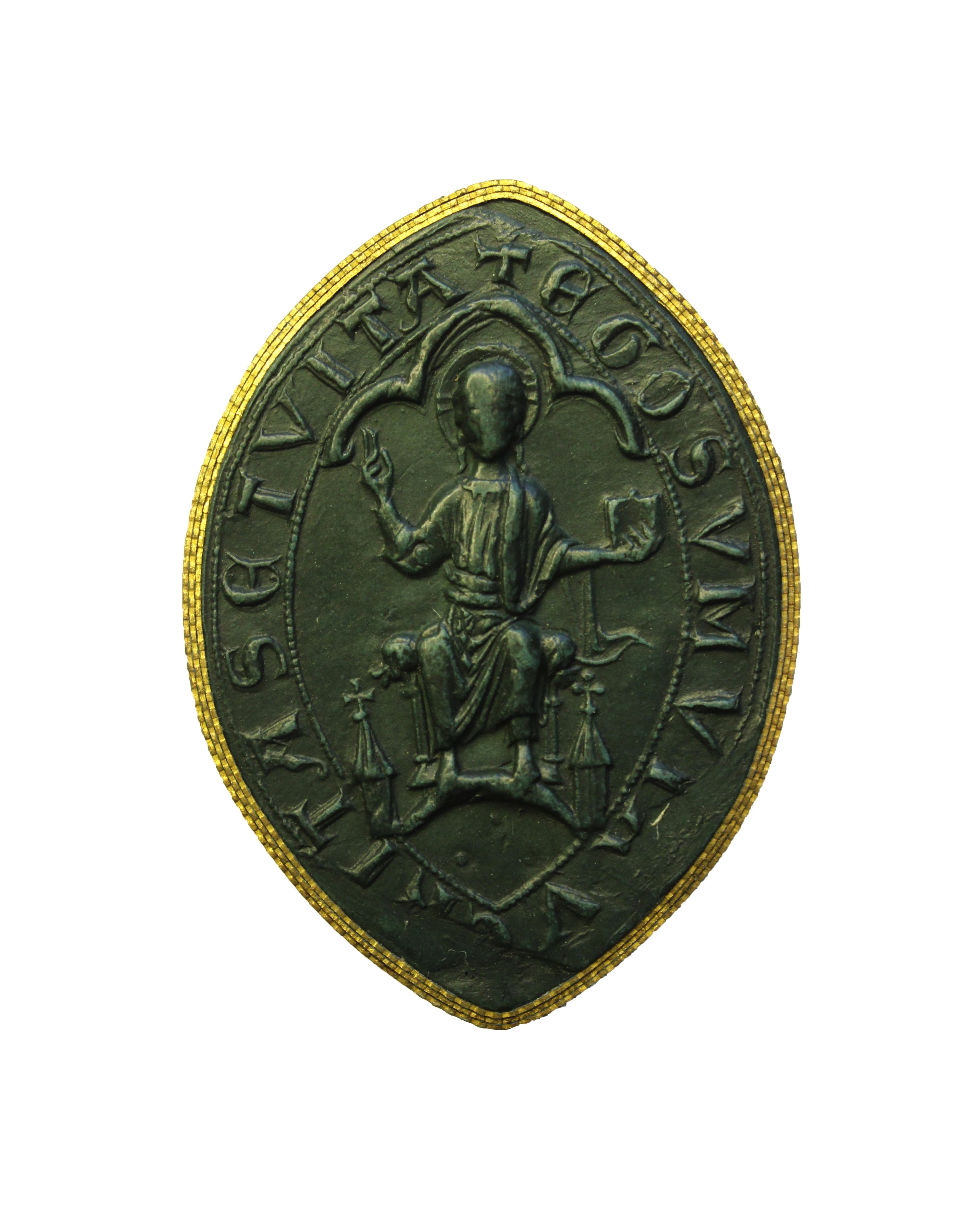 Seal. Cast of a marquise-shaped seal shows a seated man, Christ in Judgment, with both hands raised, one holding a book. He is under a three-lobed arch. Text around the perimeter is partially lost due to damage around the bottom edges. Remaining Latin text reads, “TA SETVITA EGO SVM V”.