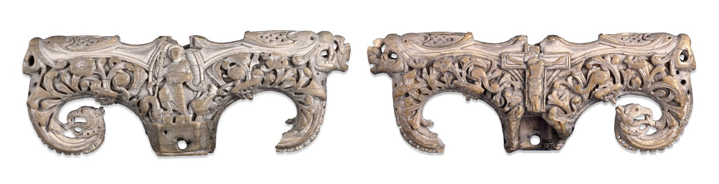 Sculpture. Two views of a T-shaped ivory terminal for a staff. Every surface is carved into leafy designs or creatures. At the intersection of the T is an image of Christ trampling the lion and dragon on one side and the crucifix on the other.