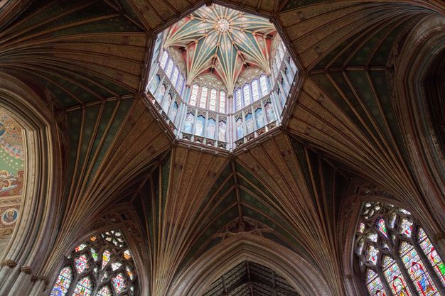 Architecture. Ribbed vaulting stretches like muscles across and down a church ceiling to meet eight columns around the perimeter of the crossing. They converge to meet like an eight-pointed star at the centre, where an octagonal opening rises like a lantern over a dome.