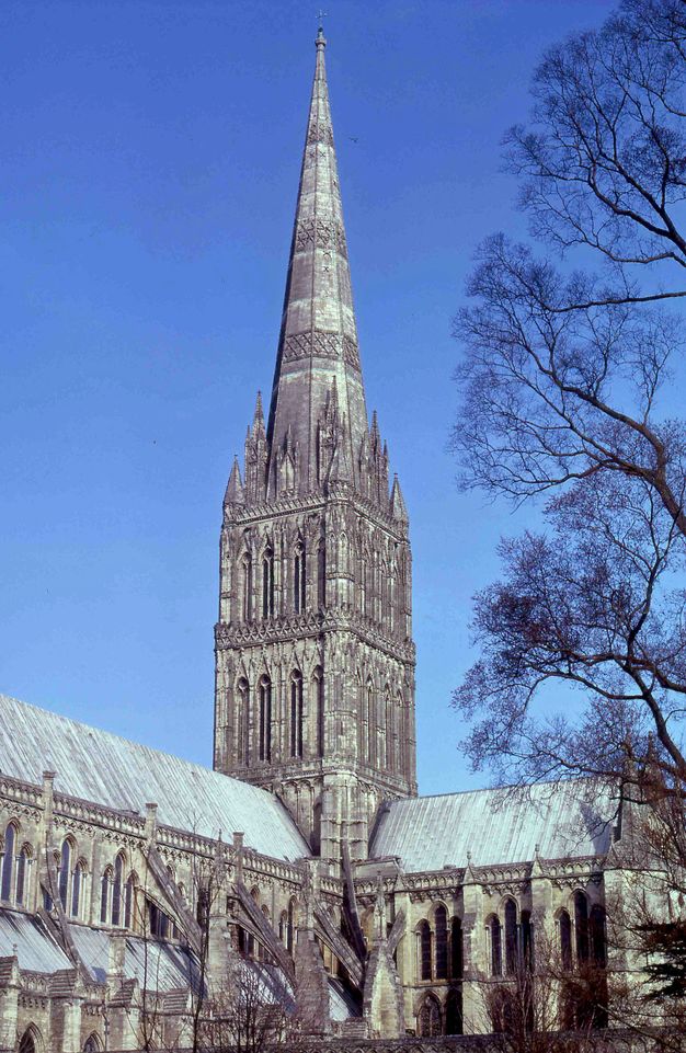 Architecture. A square tower over the crossing of a cathedral is topped with a spire at least as tall as the tower itself.