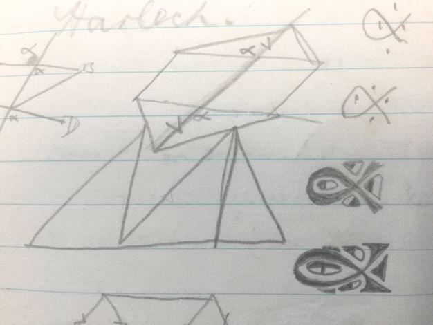 Drawing. Geometric shapes and looping forms are doodled on lined paper.