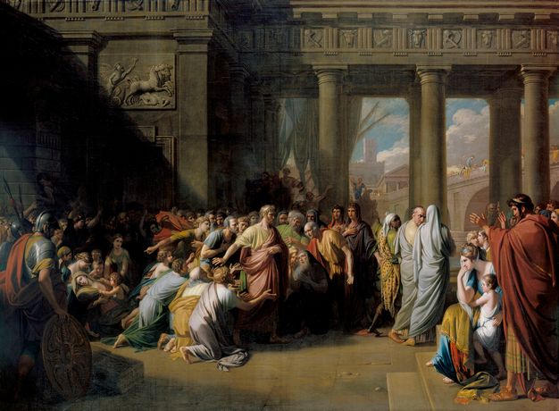 Painting. Dozens of people wearing robes or gowns in pale blue, golden yellow, sage green, or muted red gather around or look at a man walking towards a columned gateway near the centre of the composition. Some people are on their knees, and one faints.
