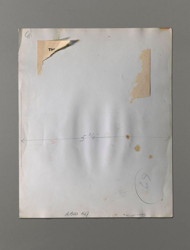The back of a photograph has a dimension marked across its width, “5 3/8””. A label is mostly torn off above.