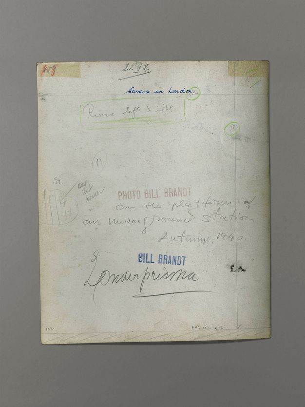 The back of a photograph has handwritten notes in pen and pencil. Two stamps read “Bill Brandt” and “Photo Bill Brandt”.