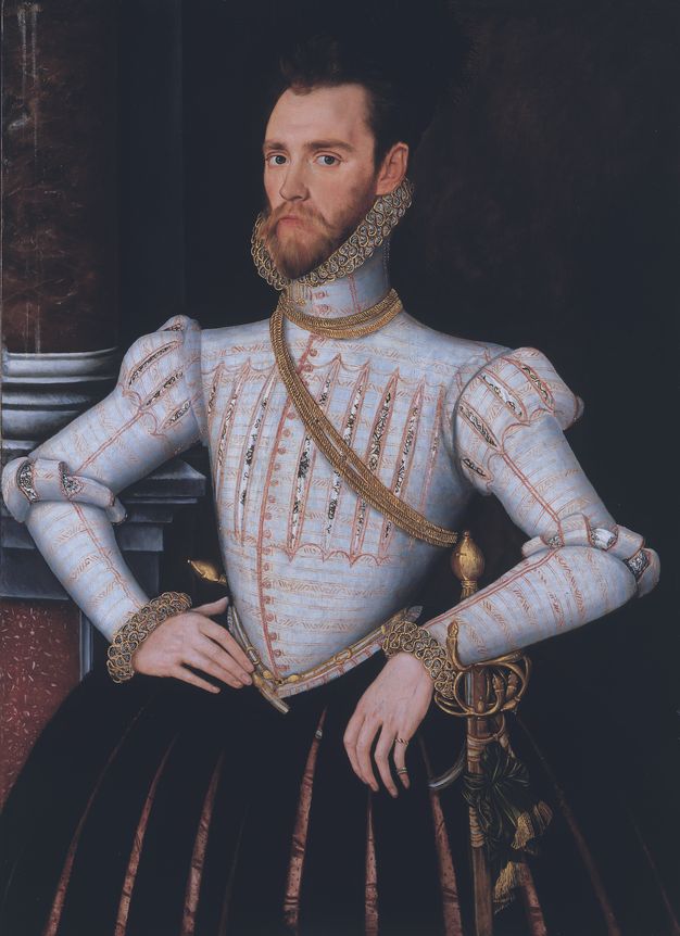 Painting. A pale-skinned man wearing a sky-blue jerkin and black puffed, slitted breeches stands in front of a column against an otherwise black background. He looks at us from the corners of his dark eyes, and his narrow, pointed chin rests in a ruff of pleated figure-eights.