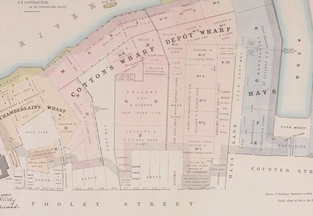 Map. An area hemmed by the Thames River above and Tooley Street below has four colour-coded areas. To our left, the “Chamberlain’s Wharf” is coloured yellow. Next, “Cotton’s Wharf” and “Depot Wharf” are both pink. The narrowest, labelled “Hay’s”, is blue.