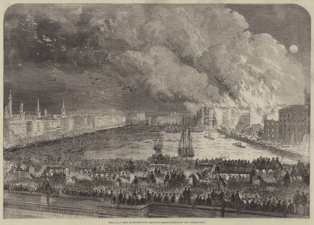 Print. Countless people line a bridge to watch burning buildings on a riverbank to our right. Smoke pours into the sky.