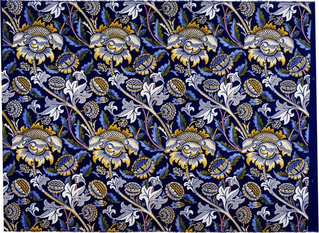 Textile. The stems of blue and yellow, stylized flowers create long, shallow, diagonal S-shapes across this fabric. Leaves are white, blue, and dark olive-green against a black background.