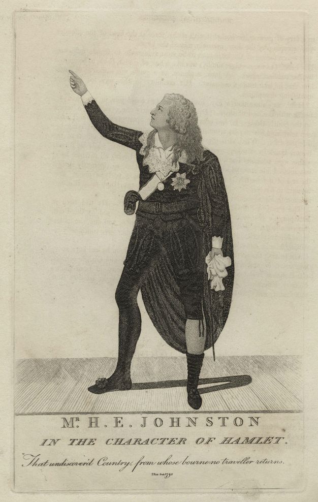 Print. A pale-skinned man with loose curls stands on a stage and holds up one hand. He wears a cape over a black suit. Text below reads, “Mr H. E. Johnston in the Character of Hamlet”.